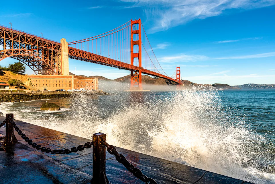 Waves crashing in San Francisco Bay at Fort Point and the Golden Gate Bridge