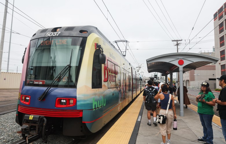 Trolley station with trolley pulling up
