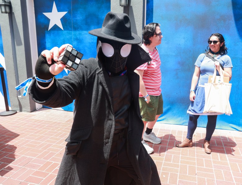black Spiderman outfit with trench coat