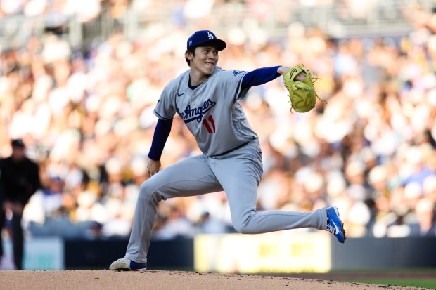 Dodgers starting pitcher Roki Sasaki throws to the plate during the first inning of a game against the San Diego Padres on Friday, June 26, 2026, in San Diego. (AP Photo/Derrick Tuskan)