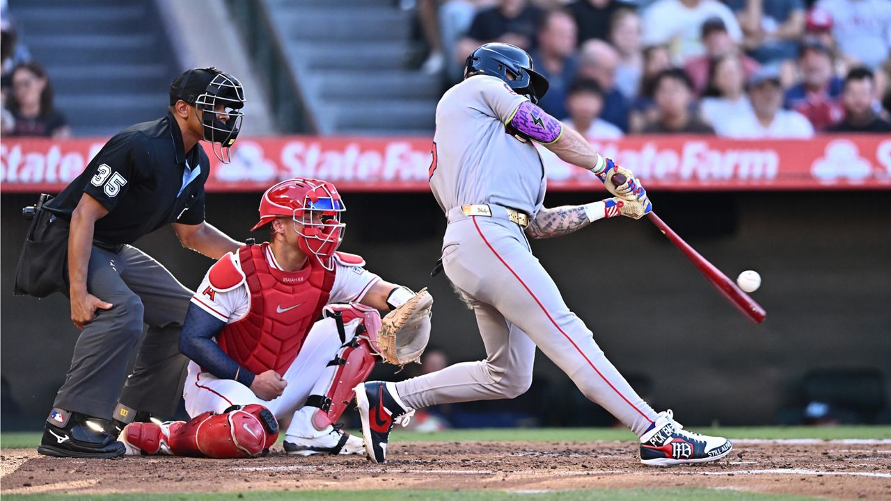 Boston Red Sox's Jarren Duran, right, hits a two-run home run during the second inning of a baseball game against the Los Angeles Angels, Sunday, July 5, 2026, in Anaheim, Calif. (AP Photo/William Liang)