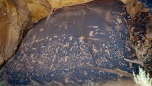 Newspaper Rock, featuring a rock panel of petroglyphs in the Indian Creek Area, is seen near Monticello, Utah, on July 14, 2016. 