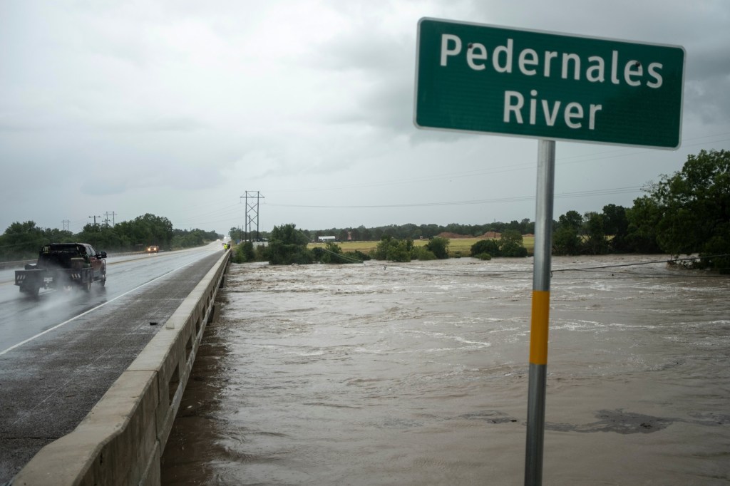 Texas flooding surges as rescuers pull people from rising waters