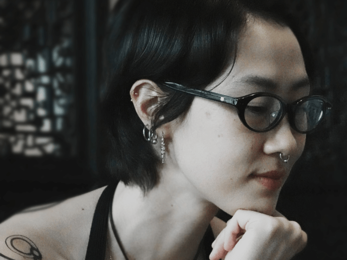 a woman with her head resting on her chin