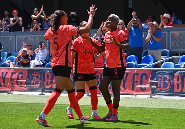 Bay FC's Karlie Lema (5) congratulates teammate Racheal Kundananji (9) after she scored a goal against the North Carolina Courage during the second half of their match at PayPal Park in San Jose, Calif., on Saturday, July 17, 2026. Bay FC defeated North Carolina 3-0. (Jose Carlos Fajardo/Bay Area News Group)