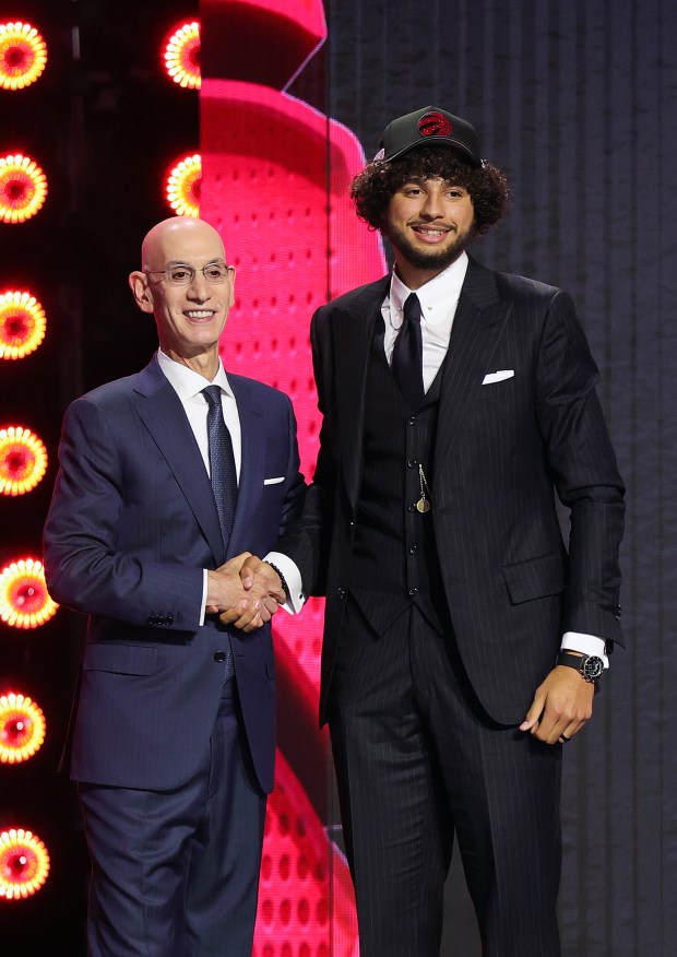 NBA commissioner Adam Silver shakes hands with Allen Graves after he is drafted nineteenth overall by the Toronto Raptors during Round One of the 2026 NBA Draft at Barclays Center on June 23, 2026 in New York City. (Photo by Arturo Holmes/Getty Images)