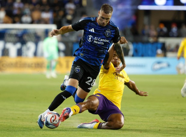 San Jose Earthquakes' Benji Kikanović (28) is tackled by Orlando City SC's Luís Otávio (5) in the second half at PayPal Park in San Jose, Calif., on Wednesday, July 22, 2026. (Nhat V. Meyer/Bay Area News Group)