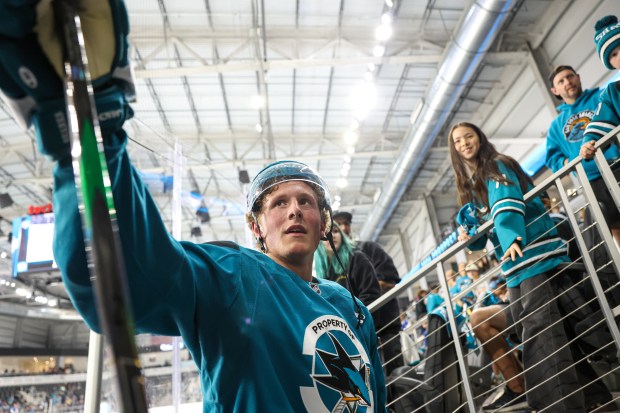 San Jose Sharks' Keaton Verhoeff (20) high fives fans after the San Jose Sharks' prospects scrimmage at Tech CU in San Jose, Calif., on Thursday, July 2, 2026. (Shae Hammond/Bay Area News Group)