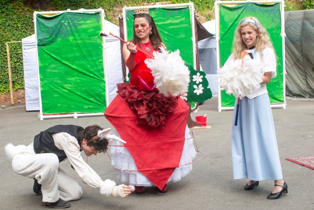 The White Rabbit (Paul Bisesi), The Queen of Hearts (Virgie Poole) and Alice (Pilar Gonzalez) in Actors Ensemble of Berkeley's "Alice in Wonderland" through July 19 at John Hinkle Park. (Photo courtesy of Jane Shamaeva)