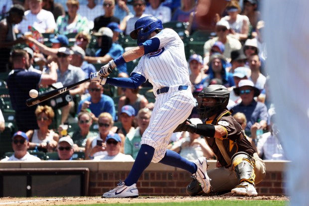 Cubs shortstop Dansby Swanson (7) hits a home run against the Padres in the second inning at Wrigley Field on July 1, 2026. (Terrence Antonio James/Chicago Tribune)