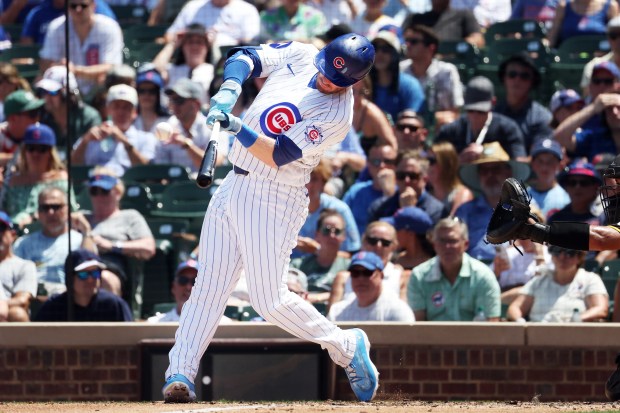 Cubs left fielder Ian Happ hits a double to right field against the Padres in the third inning at Wrigley Field on July 1, 2026. (Terrence Antonio James/Chicago Tribune)