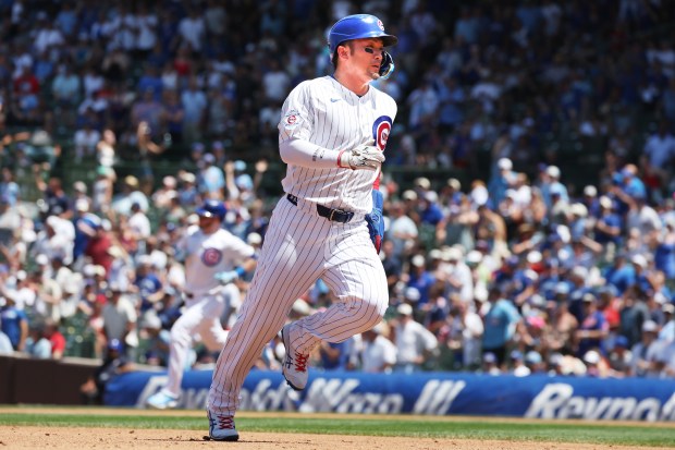 Cubs right fielder Seiya Suzuki heads to third base on a double hit by Cubs left fielder Ian Happ in the third inning against the Padres at Wrigley Field on July 1, 2026. (Terrence Antonio James/Chicago Tribune)