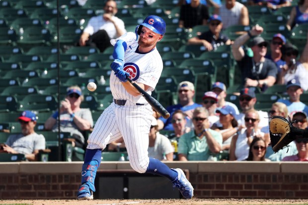 Cubs first baseman Michael Busch (29) hits a home run in the eighth inning against the Padres at Wrigley Field on July 1, 2026. (Terrence Antonio James/Chicago Tribune)