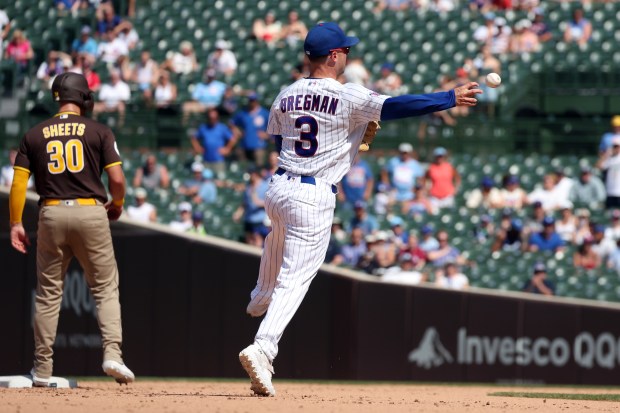 Cubs third baseman Alex Bregman (3) throws to first base to get the second out of the ninth inning against the Padres at Wrigley Field on July 1, 2026. (Terrence Antonio James/Chicago Tribune)