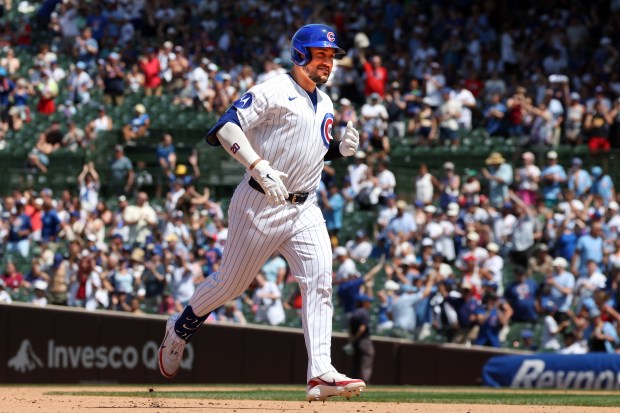 Cubs designated hitter Michael Conforto (20) rounds the bases after hitting a home run against the Padres in the fifth inning at Wrigley Field on July 1, 2026. (Terrence Antonio James/Chicago Tribune)