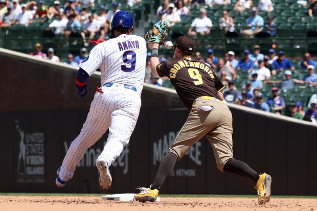 Cubs catcher Miguel Amaya (9) gets out of a run down in the fifth inning on an error by Padres second baseman Jake Cronenworth (9) at Wrigley Field on July 1, 2026. (Terrence Antonio James/Chicago Tribune)