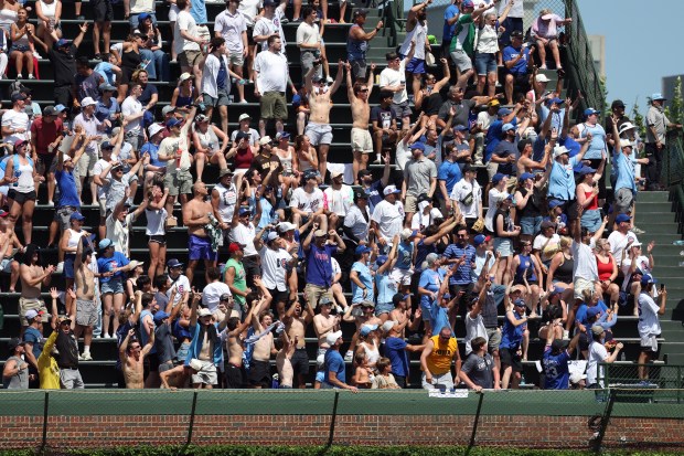Fans react to a home run by Cubs center fielder Pete Crow-Armstrong in the fifth inning of a game against the Padres at Wrigley Field on July 1, 2026. (Terrence Antonio James/Chicago Tribune)