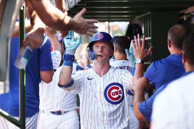 Cubs center fielder Pete Crow-Armstrong (4) is congratulated after hitting a home run against the Padres in the fifth inning at Wrigley Field on July 1, 2026. (Terrence Antonio James/Chicago Tribune)