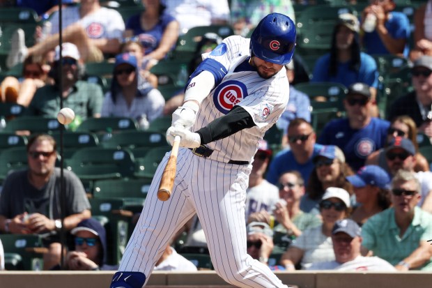 Cubs designated hitter Michael Conforto hits a home run against the Padres in the sixth inning at Wrigley Field on July 1, 2026. (Terrence Antonio James/Chicago Tribune)