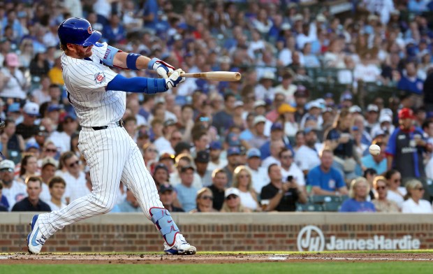 Chicago Cubs catcher Carson Kelly drives in a run on a single in the first inning of a game against the San Diego Padres at Wrigley Field in Chicago on June 30, 2026. (Chris Sweda/Chicago Tribune)