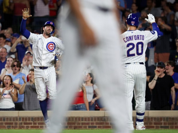 Chicago Cubs shortstop Dansby Swanson celebrates after crossing home plate following his two-run home run in the fifth inning of a game against the San Diego Padres at Wrigley Field in Chicago on June 30, 2026. (Chris Sweda/Chicago Tribune)
