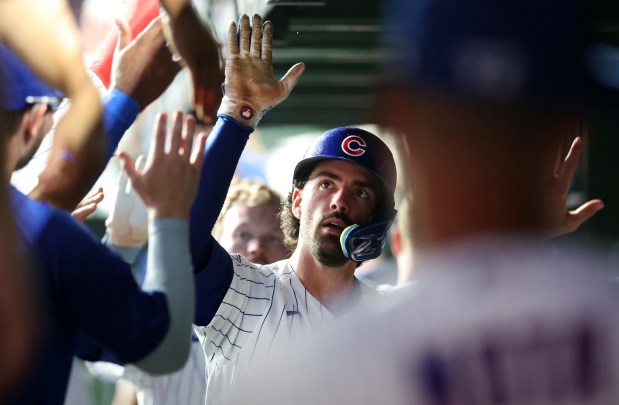 Chicago Cubs shortstop Dansby Swanson is congratulated by his teammates in the dugout after hitting a two-run home run in the fifth inning of a game against the San Diego Padres at Wrigley Field in Chicago on June 30, 2026. (Chris Sweda/Chicago Tribune)