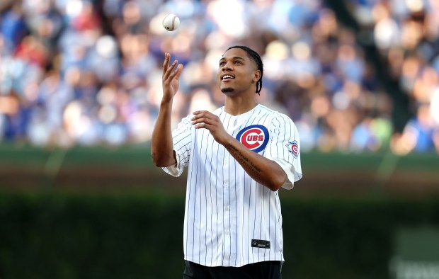 Minnesota Timberwolves player and Chicago native Terrence Shannon Jr. tosses a ball up in the air before throwing out a ceremonial first pitch before a game between the Chicago Cubs and the San Diego Padres at Wrigley Field in Chicago on June 30, 2026. (Chris Sweda/Chicago Tribune)