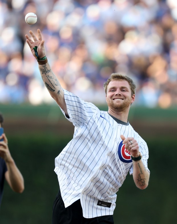 Singer/songwriter Alex Warren throws out a ceremonial first pitch before a game between the Chicago Cubs and the San Diego Padres at Wrigley Field in Chicago on June 30, 2026. (Chris Sweda/Chicago Tribune)