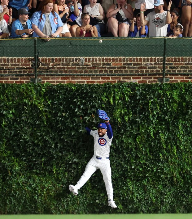 Chicago Cubs right fielder Justin Dean is unable to catch a ball that went for a solo home run for San Diego Padres second baseman Fernando Tatis Jr. in the eighth inning of a game at Wrigley Field in Chicago on June 30, 2026. (Chris Sweda/Chicago Tribune)