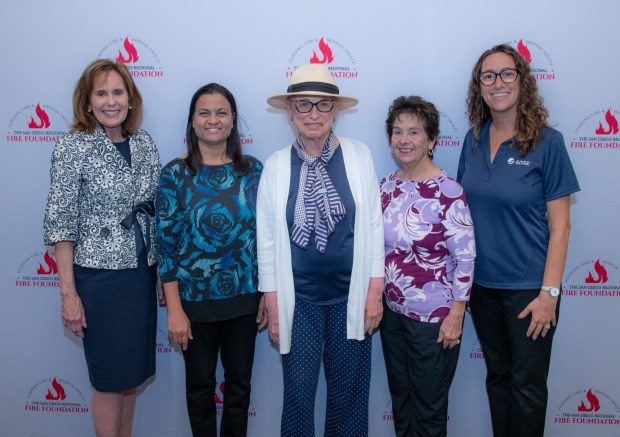 Del Mar Heights Fire Safe Council received a grant to support fire mitigation efforts in the community. Pictured are (l-r) Joan Jones of the San Diego Regional Fire Foundation with fire council members Viji Raveendran and Enid Sherman, and Ronnie Rossman and Shaina Gross of SDG&E. (Courtesy DMH FSC)