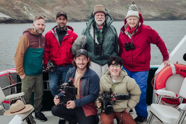 George Hunt (back row, second from right), Molly Warner (back row, right) with filmmakers Elliott Kennerson (standing, left) and Angel Morris (front row, right), and crew members (standing, second from right and front row, left) during filming of the documentary.(Perfect Four Productions)
