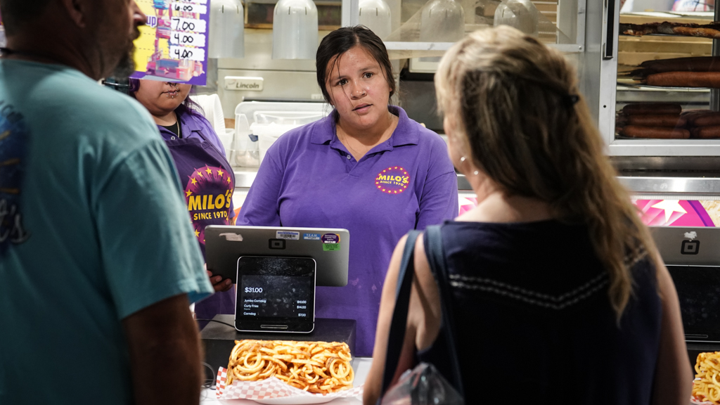 Woman taking food order
