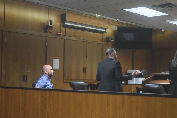 Jeremiah Roberts looks on as his attorney Alexander Reuter discusses the case with Judge Cunningham.Photo by Matt Fahr