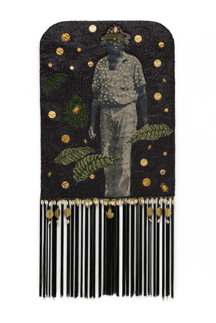 A mixed-media artwork depicts a grayscale figure adorned with gold dots, surrounded by gold spots, leaves, and decorative elements on a black background with dangling tassels at the bottom.