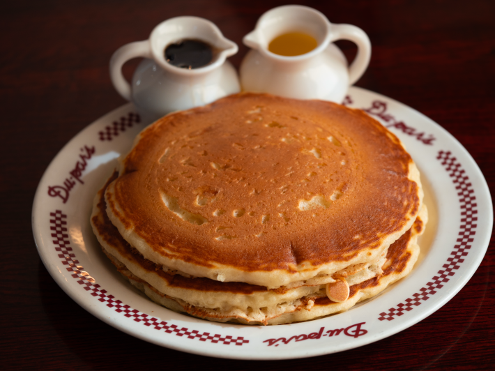 pancakes next to syrup