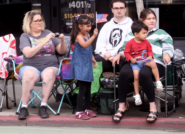 Spectators watch as the Alameda 4th of July Parade heads down Park Street in Alameda, Calif., on Saturday, July 4, 2026. (Jane Tyska/Bay Area News Group)