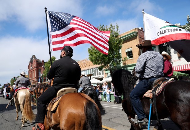A horseback riding contingent heads down Park street during the Alameda 4th of July Parade in Alameda, Calif., on Saturday, July 4, 2026. (Jane Tyska/Bay Area News Group)