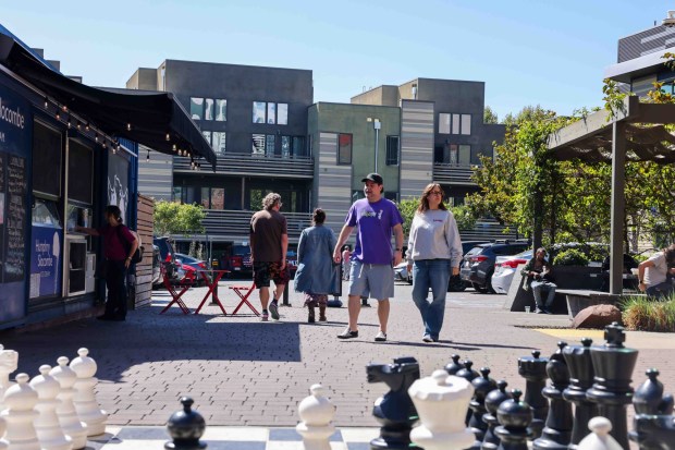 People walk through to Mason at Hive apartments in Oakland, Calif., Friday, July 17, 2026. (Ray Chavez/Bay Area News Group)