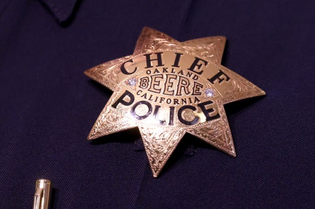 The badge of new Oakland Police Chief James Beere is displayed on his chest during his official announcement by Mayor Barbara Lee at Oakland City Hall in Oakland, Calif., on Thursday, July 9, 2026. (Ray Chavez/Bay Area News Group)