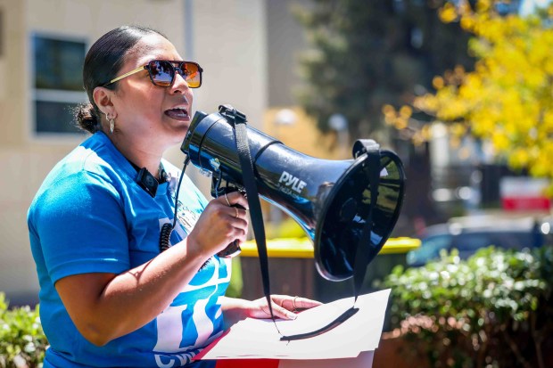 Therapist Paola Portillo speaks before staff, patient families, and healthcare advocates during a rally outside UCSF Benioff Children's Hospital Oakland in Oakland, Calif., on Thursday, July 9, 2026. The demonstration opposed the relocation of specialized treatment clinics from the East Bay to San Francisco, which forces vulnerable children battling cancer and sickle cell anemia to rely on public transit for long-distance care. (Ray Chavez/Bay Area News Group)