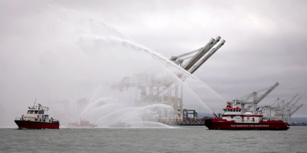 Oakland Fire Department boat "Sea Wolf" passes by vessels from neighboring fire departments as it heads to Stockton for private use on Monday, July 27, 2026, in Oakland, Calif. The firefighting boat arrived in Oakland on Sept. 2, 1994, and was removed from service in 2003. (Aric Crabb/Bay Area News Group)