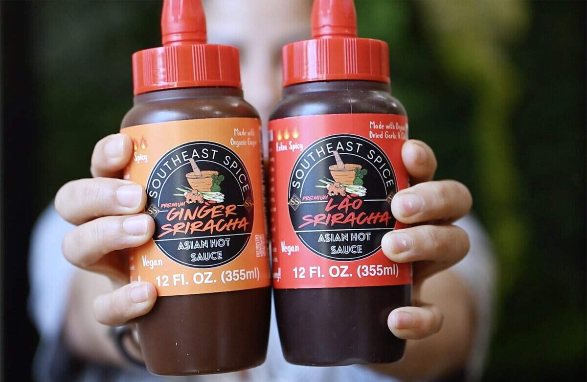 Davanh Phayarath-Khamsone shares her newly developed sriracha sauces at her Cajun-inspired Asian restaurant Sticky Chix Tuesday, July 28, 2026 in downtown Fresno.