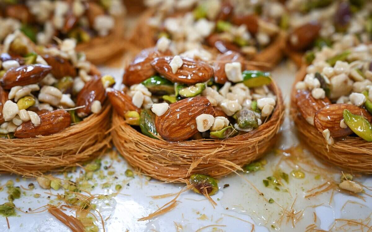 Crown of the king, round pastries filled with nuts covered in a shiny, sweet glaze sit in the display case at Rumi Baklava, a new bakery on West Shaw Avenue at Marks in Fresno.
