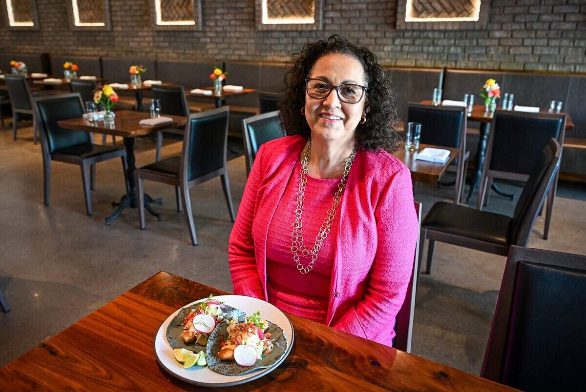 Consuelo Alvarado, owner of Tabachines Cocina, located on the southwest corner of Herndon and Palm in Fresno, sits with a plate of beer-battered halibut tacos from the restaurant which has been voted in a poll by Fresno Bee readers as the highest-end restaurant in town.