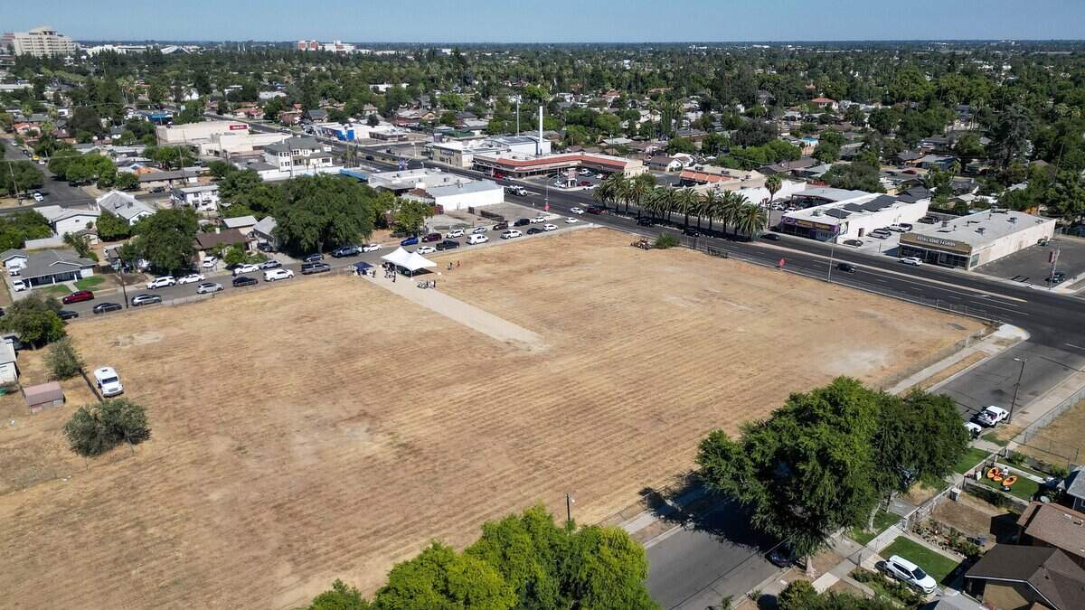 A decades-long empty lot stands on Ventura Avenue east of downtown Fresno where city officials held a groundbreaking ceremony to begin construction on an affordable housing apartment complex, on Friday, July 24, 2026.