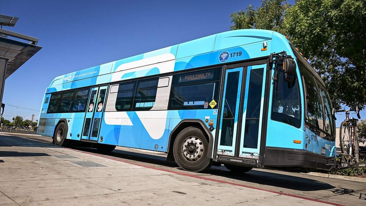A Fresno Area Express, or FAX, bus stops at the Manchester Transit Center to pick up and drop off riders on Wednesday, July 22, 2026. FAX is the primary public mass transit system serving the City of Fresno and parts of neighboring Clovis, California. The system is operated by the city's Department of Transportation which manages a fleet of over 100 buses that operate across nearly 20 fixed routes.