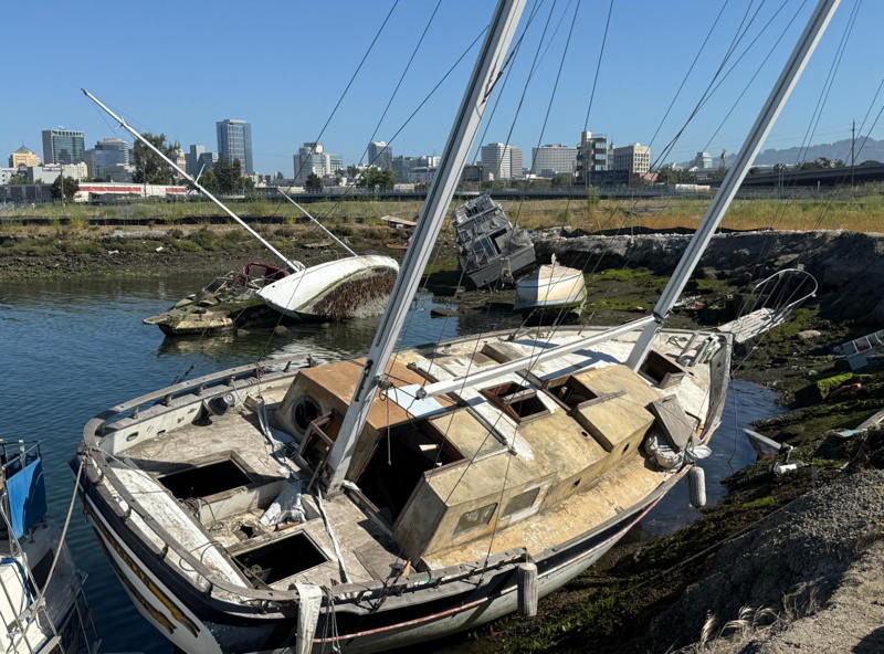 Five of over 40 abandoned and derelict boats along Oakland's 'Gold Coast.'