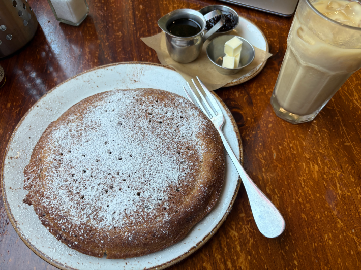 a pancake with powdered sugar