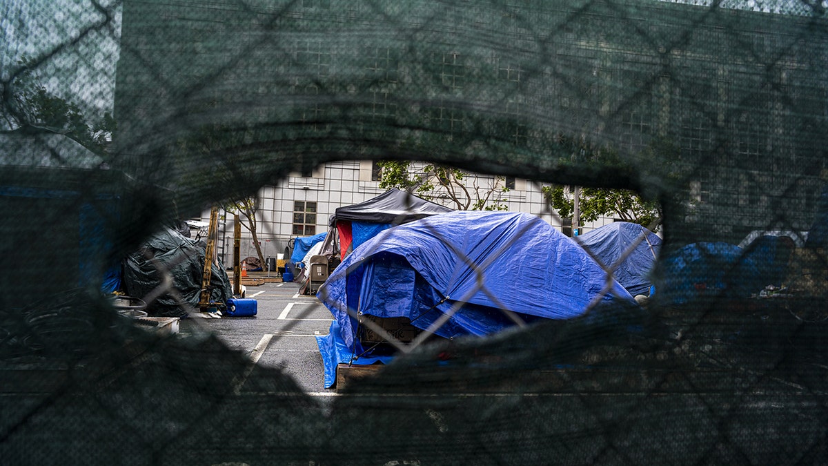 san francisco homeless encampment behind fence