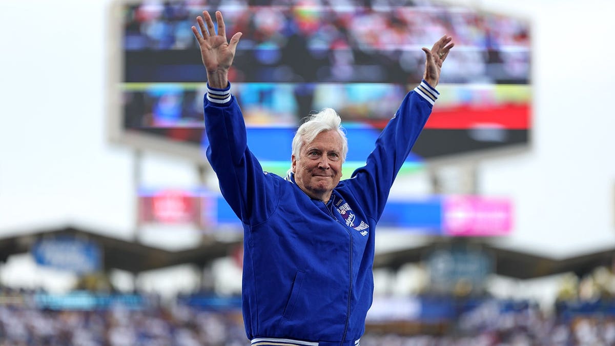 Dodgers CEO and Owner Mark Walter waves to the crowd during the 2025 Back-to-Back World Champions Ring Ceremony.